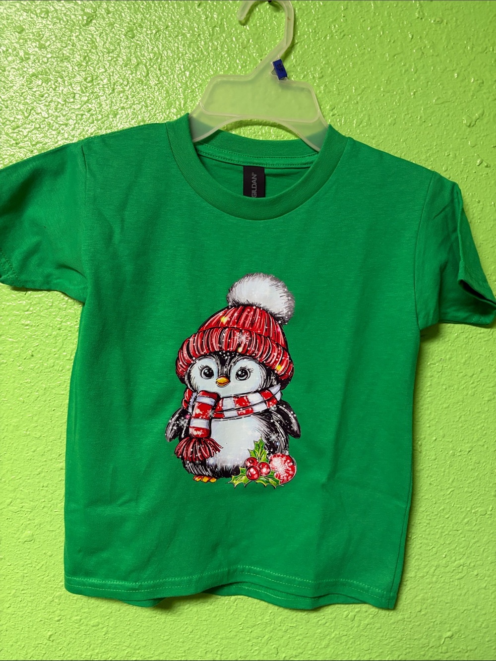 Gildan Green Kids Tee with Penguin Wearing Red Hat and Scarf